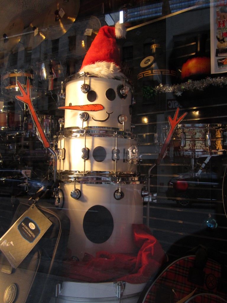 A holiday window display at Sam Ash Drum Shop on 48th Street in Manhattan