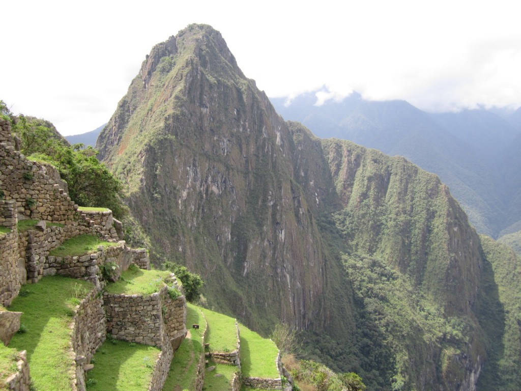 The iconic peak, Huayna Picchu, rises majestically behind the ruins of Machu Picchu