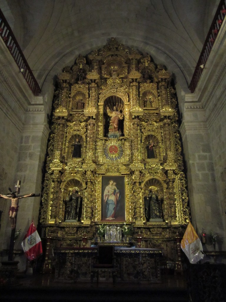 Carved wooden alters with gold leaf adorn the inside of the Iglesia de la Compania