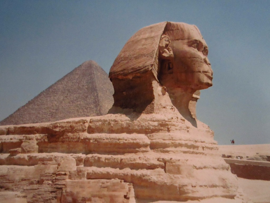 The Great Pyramid peeks out from behind the Sphinx at Giza in Egypt. 